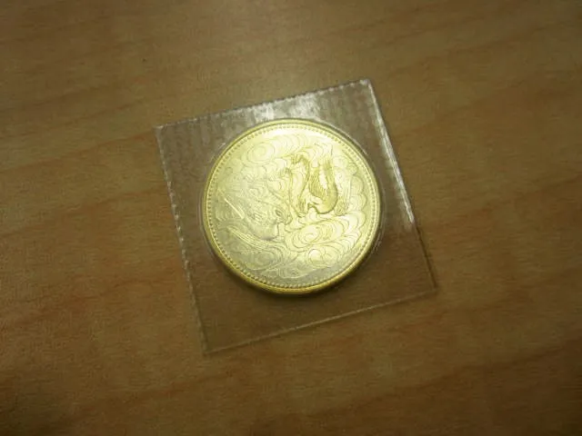 天皇陛下御在位60年記念10万円金貨
