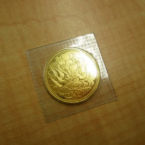 天皇陛下御在位60年記念10万円金貨